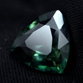 5.50ct deep green sapphire, a trillion-shaped natural loose gemstone.